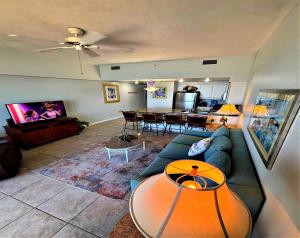a living room with a couch and a table at Wyndham Ocean Walk Penthouse Floor 1 BR Resort Condo By The Sea - Daytona Funland 1908 in Daytona Beach