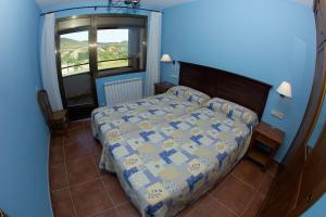 Postel nebo postele na pokoji v ubytování Apartamentos Turmo