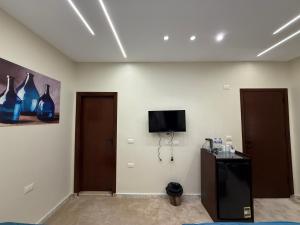 TV a/nebo společenská místnost v ubytování Alba pyramids view