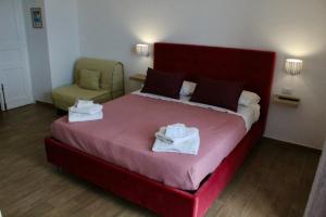 Postel nebo postele na pokoji v ubytování Antares Rooms