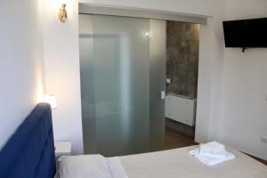 Postel nebo postele na pokoji v ubytování Antares Rooms
