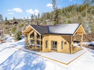 a rendering of a house in the snow at Lothlórien Lodge | 8p | Sauna in Vradal