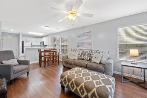 a living room with a couch and a ceiling fan at 53C Tee to Sea condo in Pawleys Island