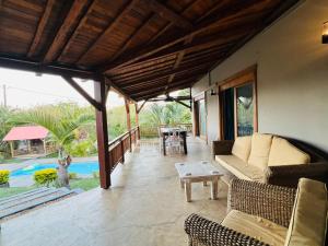 a living room with a couch and a table at The Secret Oasis Villa in Cap Malheureux