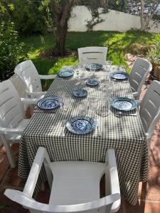a table with blue and white dishes on it at Villa Loupiro in Mijas