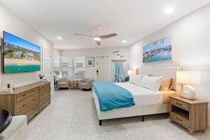 a bedroom with a large bed and a living room at Pool Beachfront Studio in Fort Lauderdale +42 photos
