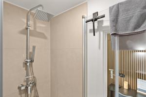 a shower with a glass door in a bathroom at City-Apartment - Kurze Wege zu Messe und LanxessArena in Cologne +21 photos
