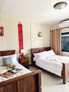 Postel nebo postele na pokoji v ubytování COZY HOMESTAYs ที่พักกลางใจเมืองเชียงใหม่ + 88 fotografií