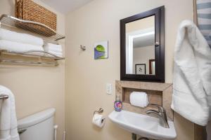 a bathroom with a sink and a mirror at Kona Islander Inn#309 in Kailua-Kona +31 photos
