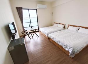 Postelja oz. postelje v sobi nastanitve Endless Summer Homestay