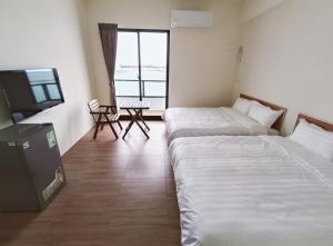 Postelja oz. postelje v sobi nastanitve Endless Summer Homestay