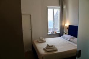 Postel nebo postele na pokoji v ubytování Antares Rooms