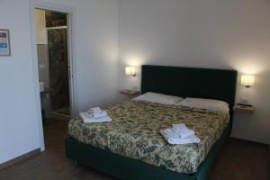 Postel nebo postele na pokoji v ubytování Antares Rooms