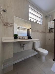 a bathroom with a sink and a toilet at Refúgio Aconchegante em Botafogo in Rio de Janeiro