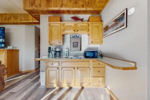 a kitchen with wooden cabinets and a counter top at Sanctuary in Pigeon Forge