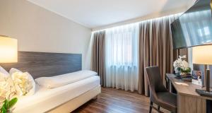 Postel nebo postele na pokoji v ubytování PLAZA Hotel Buchhorner Hof + 37 fotografií