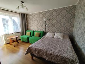 Postel nebo postele na pokoji v ubytování Apartamenty i pokoje u Kryni
