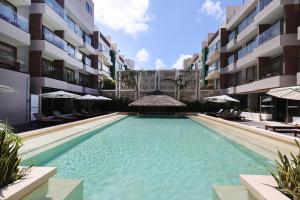 Bazén v ubytování Holiday Inn Tulum by IHG nebo v jeho okolí