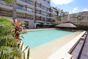 Bazén v ubytování Holiday Inn Tulum by IHG nebo v jeho okolí