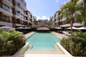 Bazén v ubytování Holiday Inn Tulum by IHG nebo v jeho okolí