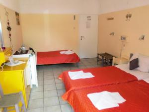 Postel nebo postele na pokoji v ubytování Hotel Neos Matala
