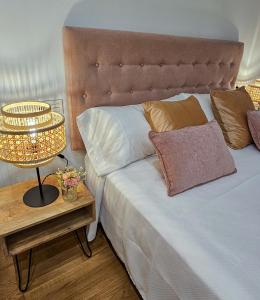 En eller flere senge i et værelse på Casa Entre Viñas, jardin privado con piscina comunitaria