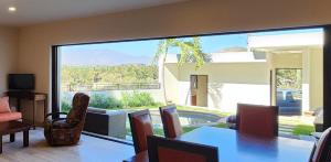 a living room with a large sliding glass door with a view at Casa Vista Animas San Jose del Cabo in San José del Cabo