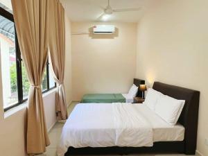 a bedroom with a bed and a window at 45GeorgeTown Multi Family corner lot free parking food convenience stores nearby in George Town