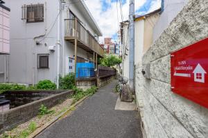 an alley in an alley between two buildings at Y's INN NishiShinjuku 018T in Tokyo