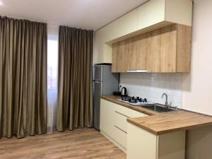 Η κουζίνα ή μικρή κουζίνα στο T&T Cozy Apartment Rustavi