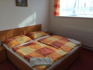 Posteľ alebo postele v izbe v ubytovaní Penzion Rakovec