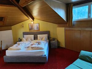 a bedroom with a bed with white sheets at Hotel Residence Rosa in San Lugano +94 photos