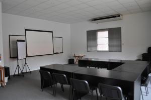 a room with a black table and chairs and a whiteboard at Hotel El Molino in Venado Tuerto +29 photos