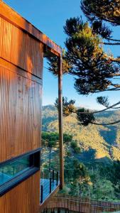 a house with a view of a mountain at Cabanas Terrunyo - Cabana Bela in Urubici +22 photos