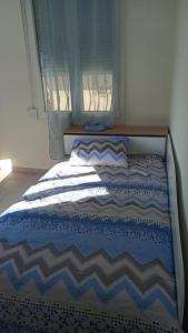 Ένα ή περισσότερα κρεβάτια σε δωμάτιο στο TenTen Apartments