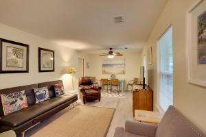 a living room with a couch and a table at Downtown Home with Yard and BBQ - 6 Mi to Downtown! in Beaufort