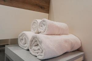 a stack of towels sitting on top of a counter at LovelyHouseBraida in Milan +106 photos