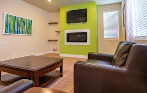 a living room with a couch and a table at Newly Built 4BR Spacious Retreat in Peyton in Peyton +18 photos