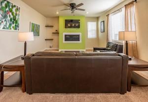 a living room with a couch and a table at Newly Built 4BR Spacious Retreat in Peyton in Peyton