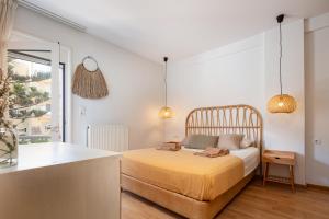 Ένα ή περισσότερα κρεβάτια σε δωμάτιο στο Akasha living by the sea