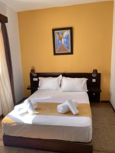 Postel nebo postele na pokoji v ubytování Hotel Chaouen