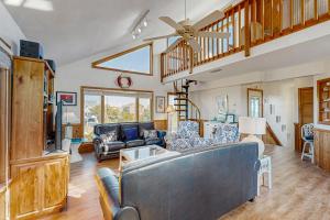 a living room with a couch and a table at Feelin' Nauti 866 in Waves