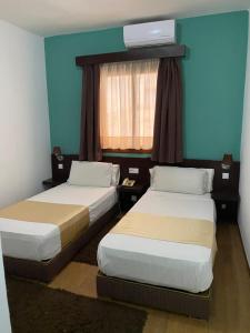 Postel nebo postele na pokoji v ubytování Hotel Chaouen
