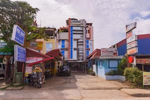 a street in a city with buildings at Voyagers Palace in Puerto Princesa City