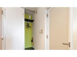 a mirror reflection of a room with a closet at The OneFive Sendai - Vacation STAY 45045v in Sendai