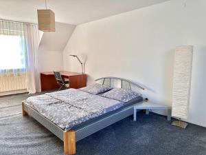 Postel nebo postele na pokoji v ubytování OKW Pilsko