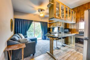 a kitchen and living room with a couch and a table at Charming New York Retreat with Lake Champlain Views! in Alburg