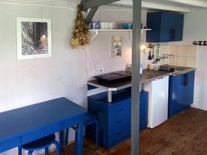 A kitchen or kitchenette at Domek Rybaka