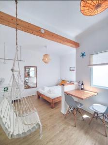 Ένα ή περισσότερα κρεβάτια σε δωμάτιο στο Boho Bispo Apartments