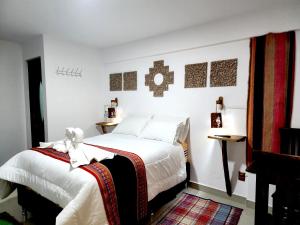 Postel nebo postele na pokoji v ubytování Hotel Sal Andina